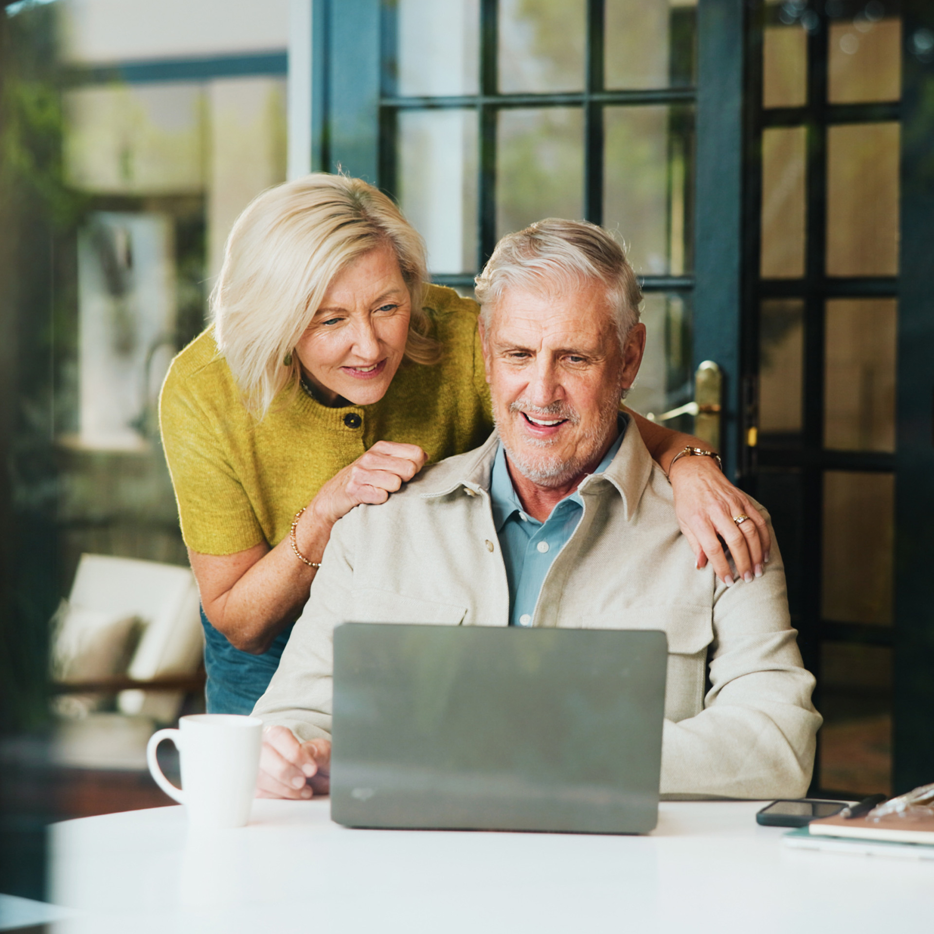 elderly-couple-at-table-square retired couple whole wealth management